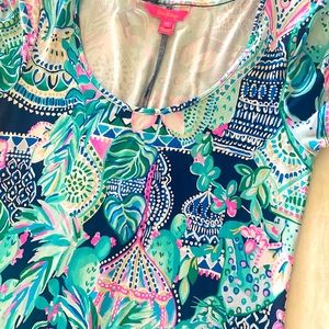 This lily dress is short sleeve with a side slit, very comfortable